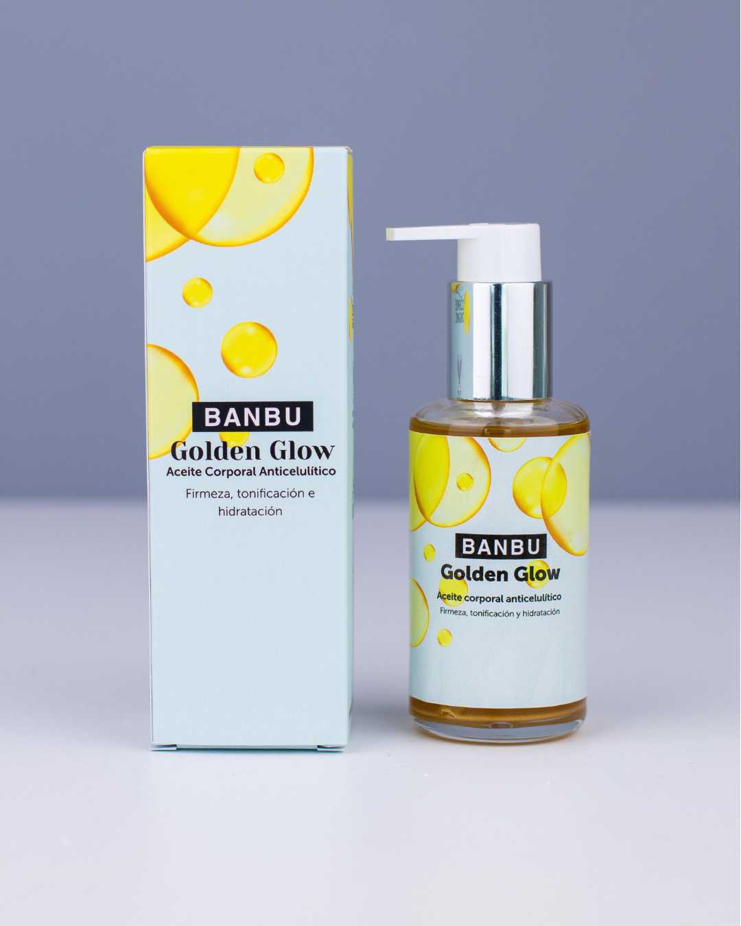 Aceite anticelulítico Golden Glow junto a su caja, un anticelulítico efectivo que actúa como aceite corporal reafirmante.
